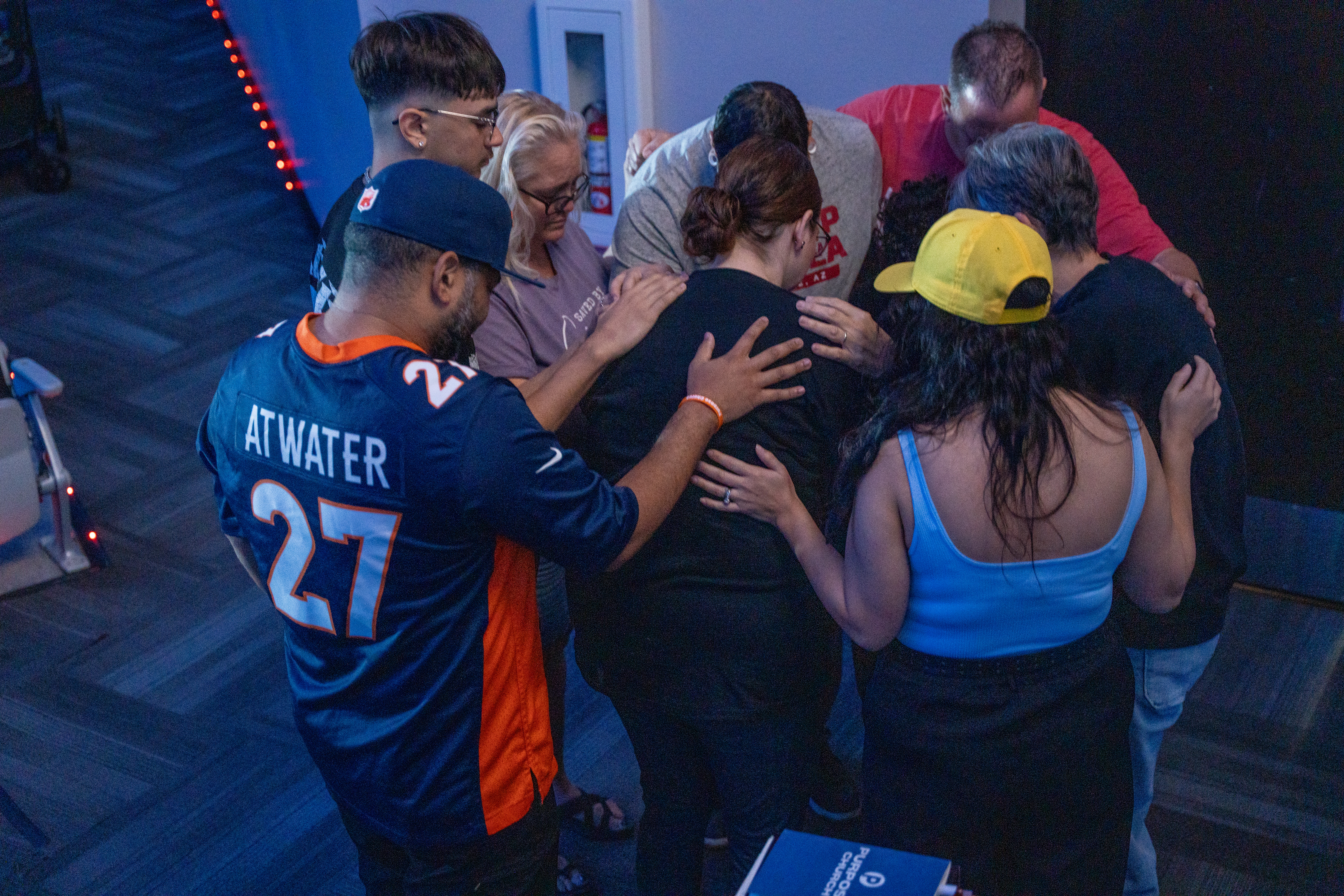 A group praying together at Purpose Church